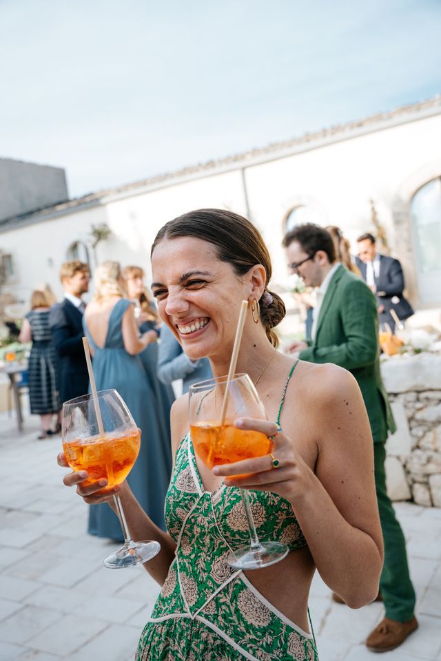 Female guests at a wedding in cocktail attire