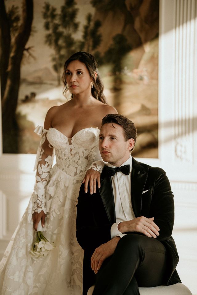 Bride in a formal gown and groom in a black tuxedo