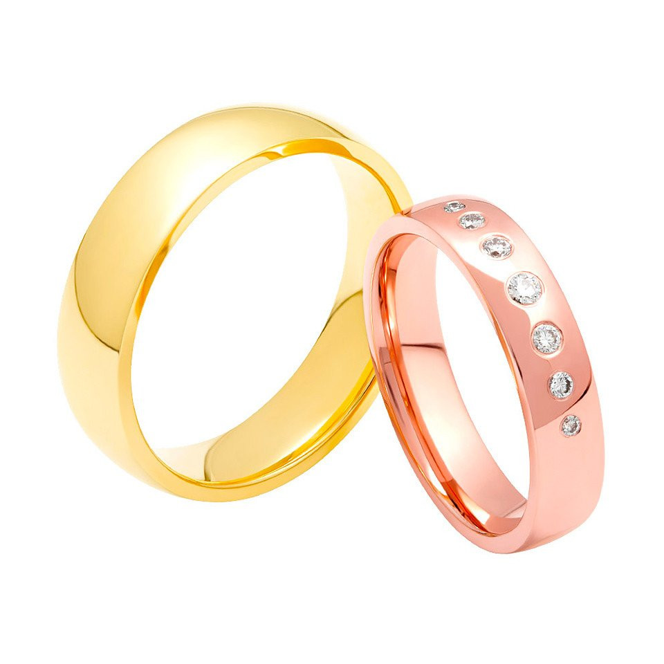 twee trouwringen in roségoud en zilver