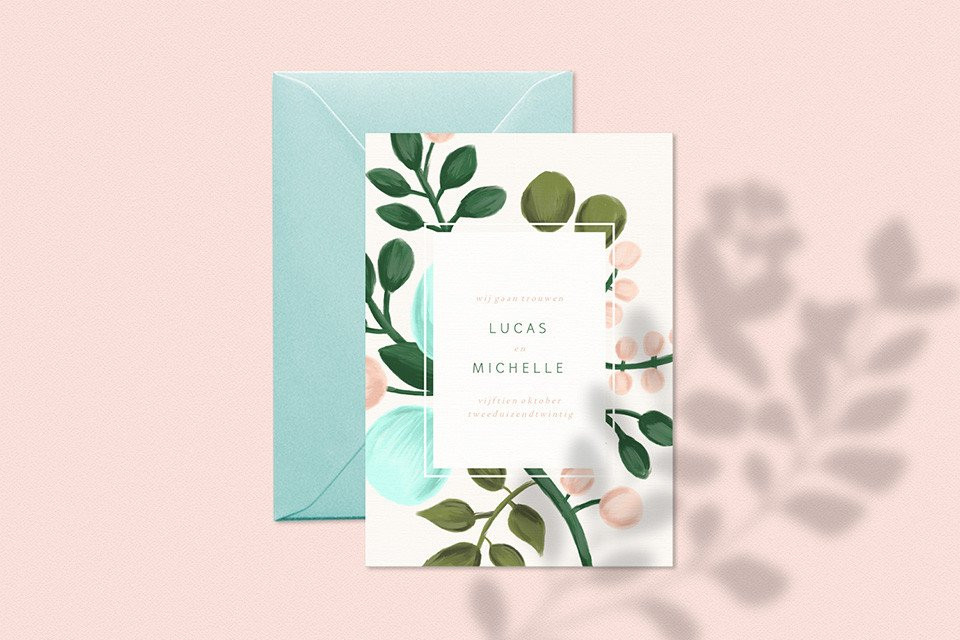 een trouwuitnodiging met een bloemendesign