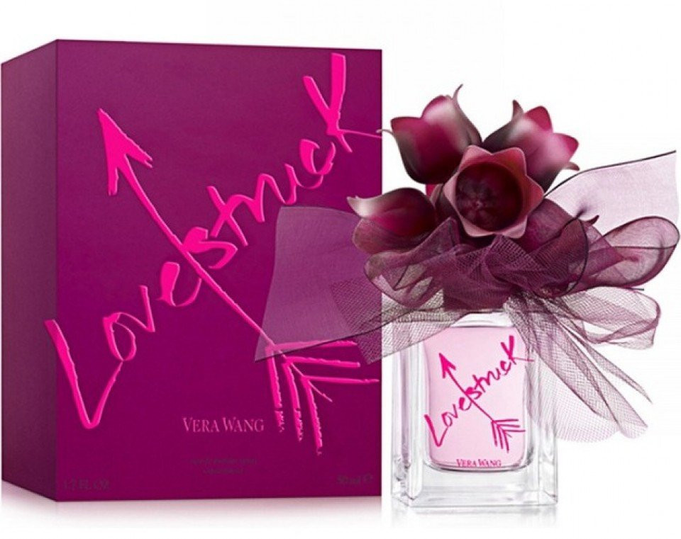 een paarse doos met een roze strik en een paarse bloem